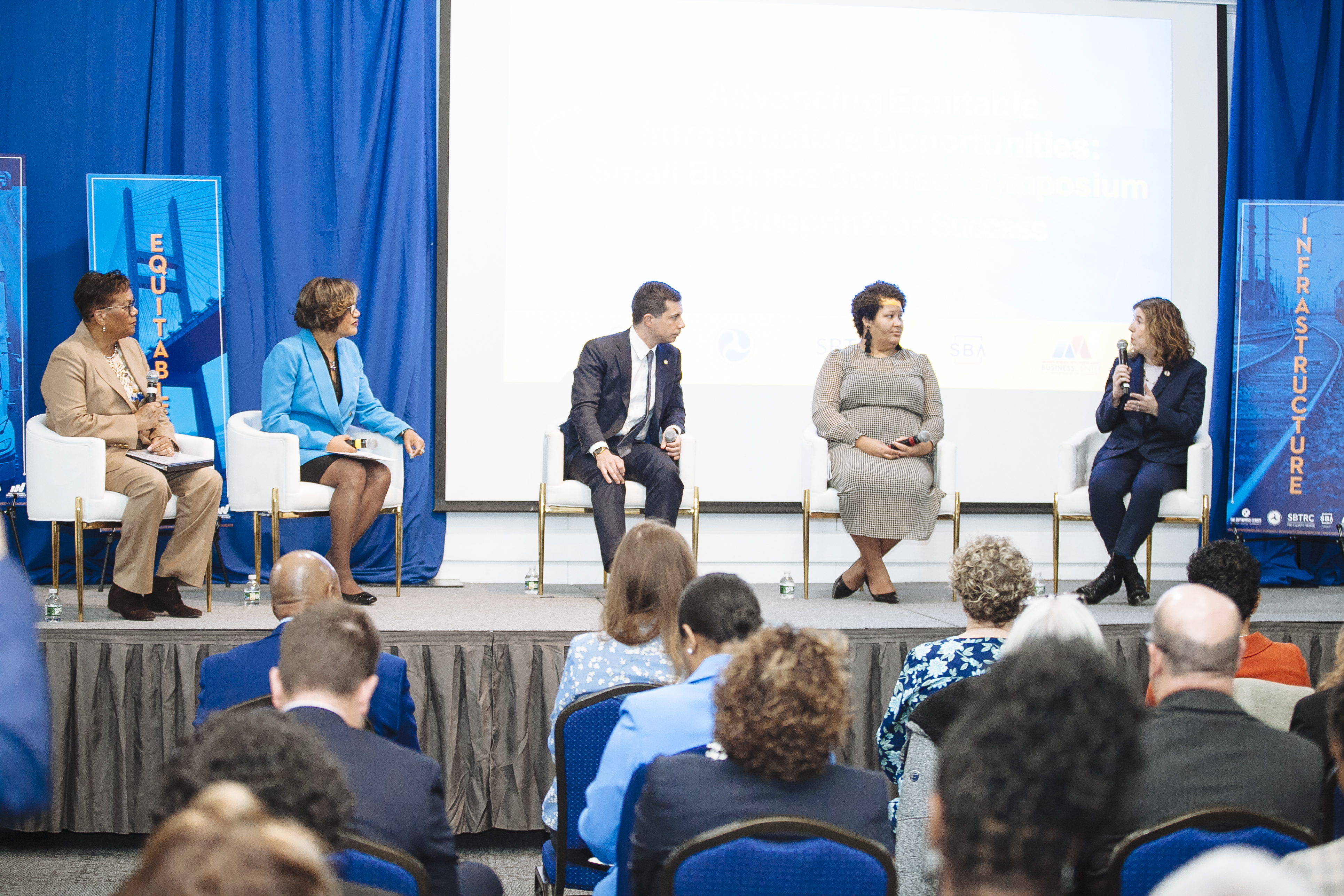 Panel of event speakers with Pete Buttigieg