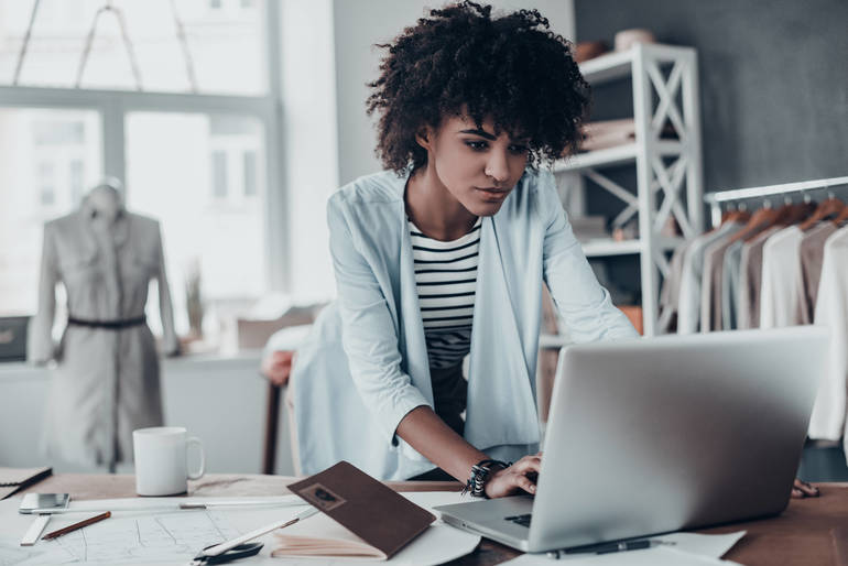 woman looking at laptop